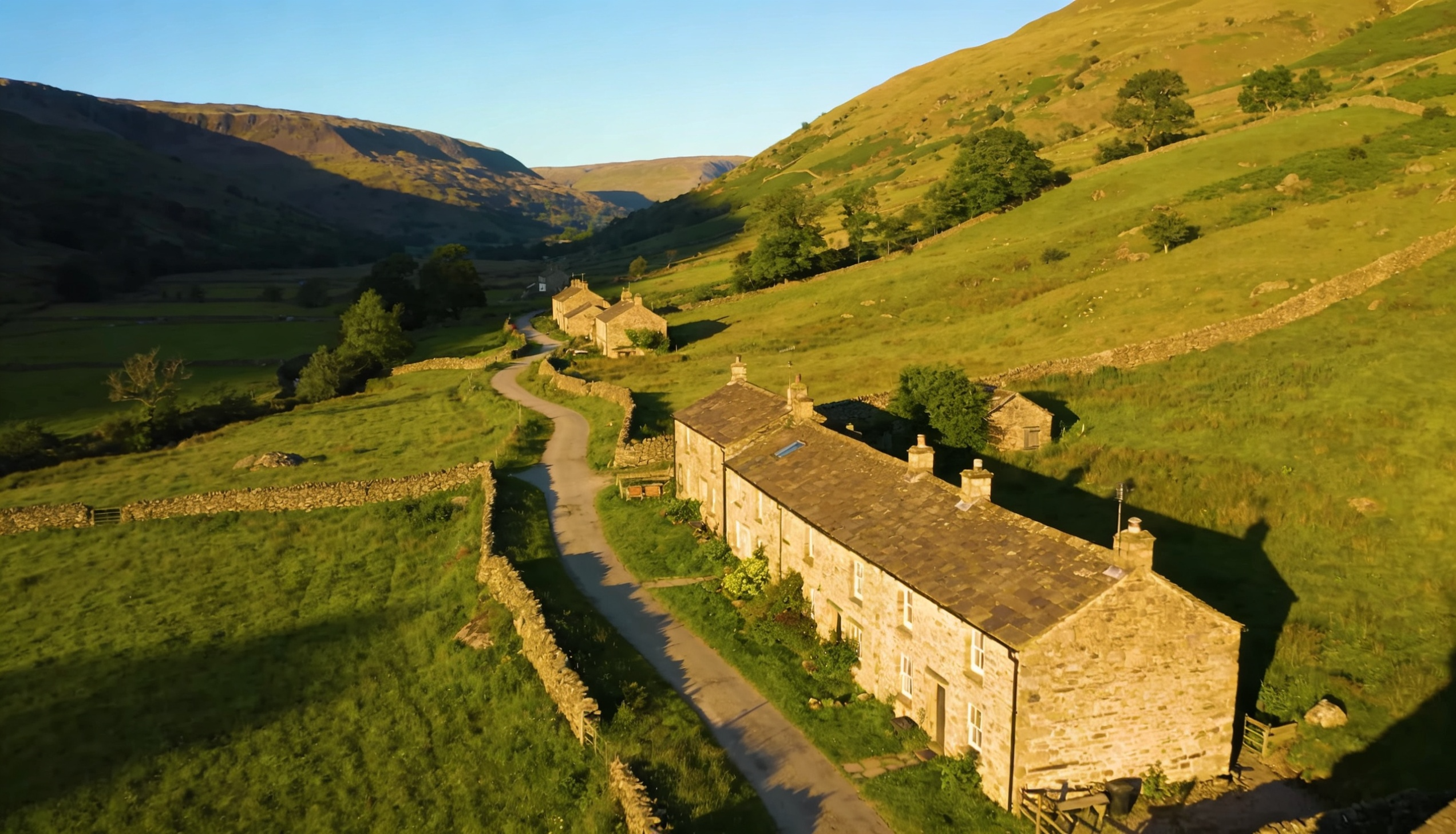 A picturesque Yorkshire Dales landscape featuring charming stone cottages and rolling green hills.